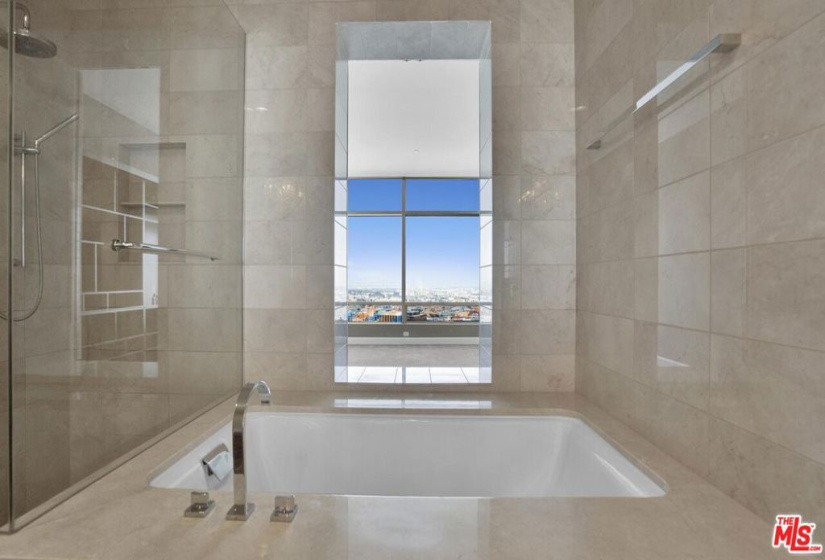 enjoy a spa-like bath with amazing city views